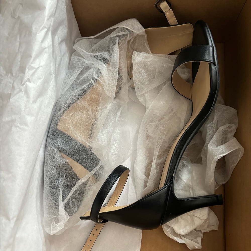 Black low heeled ankle straps , never worn size 9